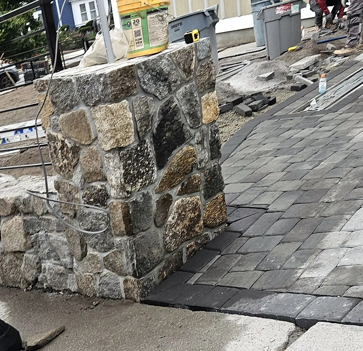 Fieldstone pillar and paver driveway going in